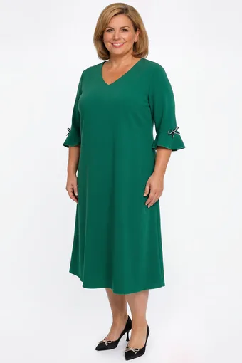 Abito verde con fiocchi neri