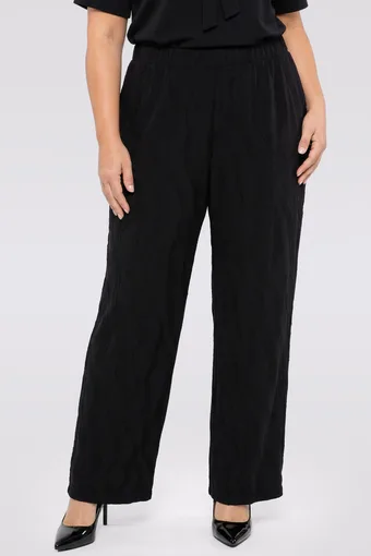 Pantaloni neri con una fantasia discreta