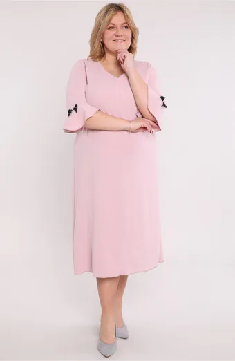 Abito rosa chiaro con fiocchi neri