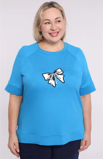 Camicetta blu con applicazioni