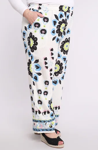 Pantaloni bianchi con fiori colorati