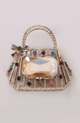 Spilla a forma di borsa color oro