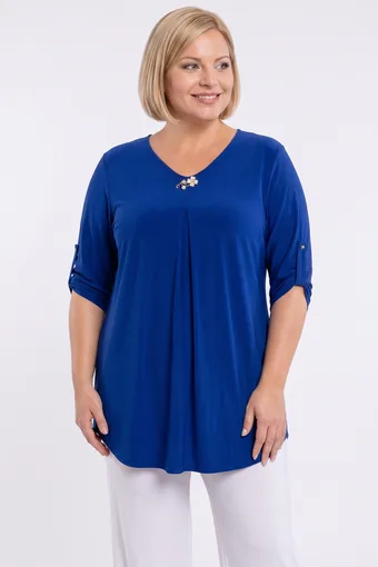 Tunica blu fiordaliso con spilla